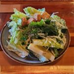 Caesar Salad - Caesar Salad of chopped romaine lettuce and garlicky croutons, tossed in a creamy house Caesar dressing.