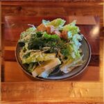 Side Caesar Salad - Caesar Salad of chopped romaine lettuce and garlicky croutons, tossed in a creamy house Caesar dressing.