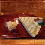 New York Cheesecake - A generous wedge New York Cheesecake drizzled with caramel sauce and topped with Irish Cream Sauce.